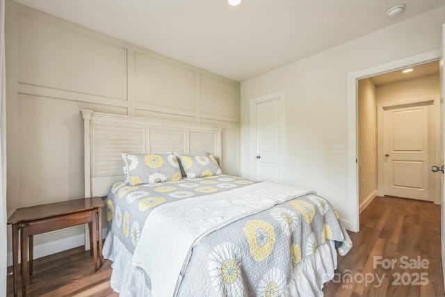 274 Old Bristol Rd, Boone, NC 28607 - bedroom with dark wood-style floors, a decorative wall, and recessed lighting