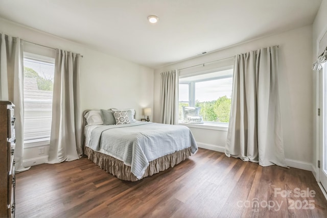 274 Old Bristol Rd, Boone, NC 28607 - bedroom with wood finished floors, multiple windows, and baseboards