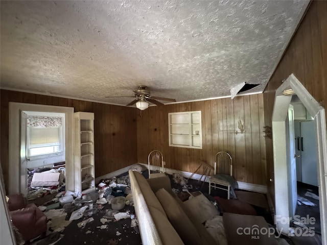 31 Conrad St, Lexington, NC 27295 - living area with a textured ceiling, ceiling fan, and wood walls
