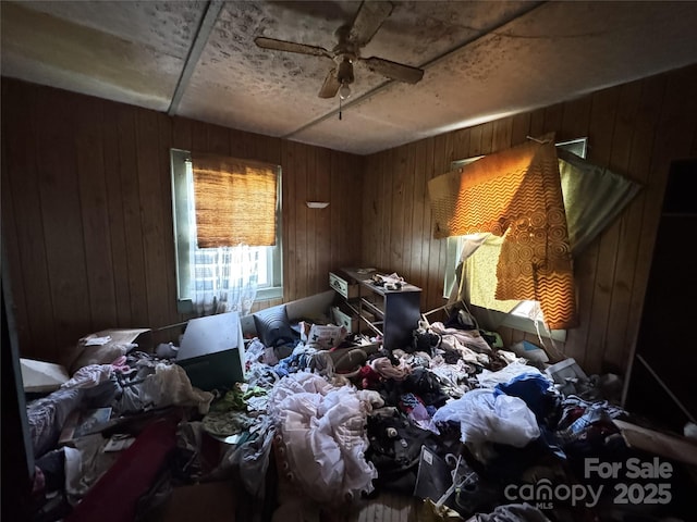 31 Conrad St, Lexington, NC 27295 - miscellaneous room with wood walls and a ceiling fan