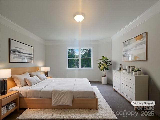 bedroom with baseboards, dark colored carpet, and crown molding