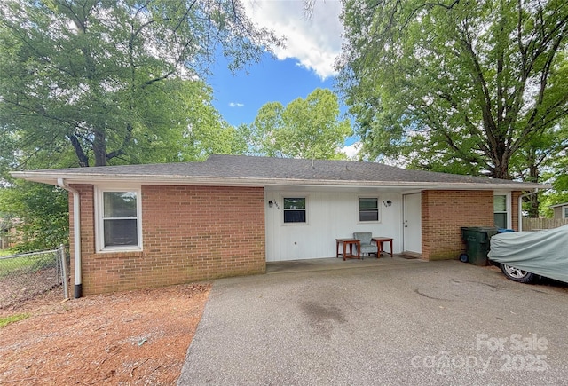 1464 19th Ave NE, Hickory, NC 28601 - view of front of home with fence, brick siding, and a patio