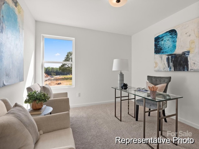 carpeted home office featuring baseboards