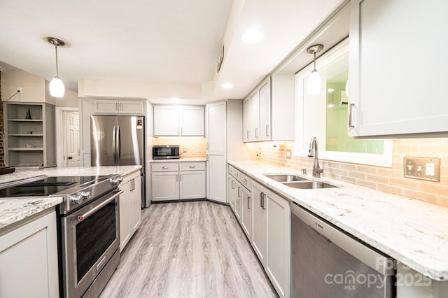 3520 4th Street Blvd NW, Hickory, NC 28601 - kitchen with a sink, stainless steel appliances, decorative backsplash, and pendant lighting