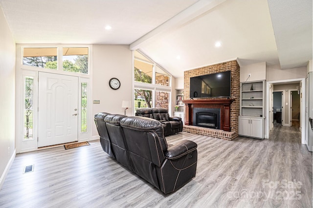 3520 4th Street Blvd NW, Hickory, NC 28601 - living room featuring wood finished floors, beam ceiling, a fireplace, baseboards, and high vaulted ceiling