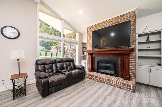 3520 4th Street Blvd NW, Hickory, NC 28601 - living room featuring wood finished floors, a fireplace, baseboards, high vaulted ceiling, and built in features
