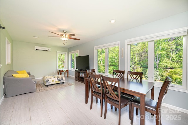 3520 4th Street Blvd NW, Hickory, NC 28601 - dining space with a wall mounted air conditioner, baseboards, and a ceiling fan