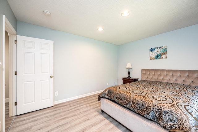 3520 4th Street Blvd NW, Hickory, NC 28601 - bedroom with light wood finished floors, recessed lighting, and baseboards