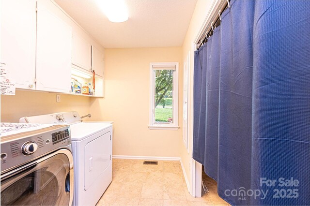 3520 4th Street Blvd NW, Hickory, NC 28601 - washroom with cabinet space, independent washer and dryer, and baseboards