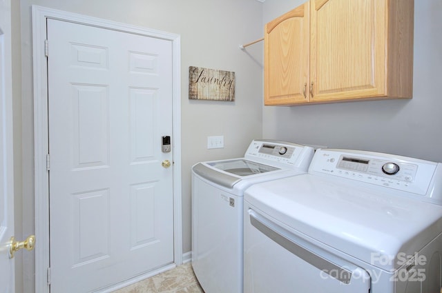 washroom with cabinet space and washing machine and clothes dryer