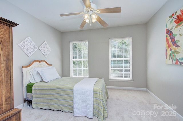 bedroom featuring carpet floors, baseboards, and ceiling fan