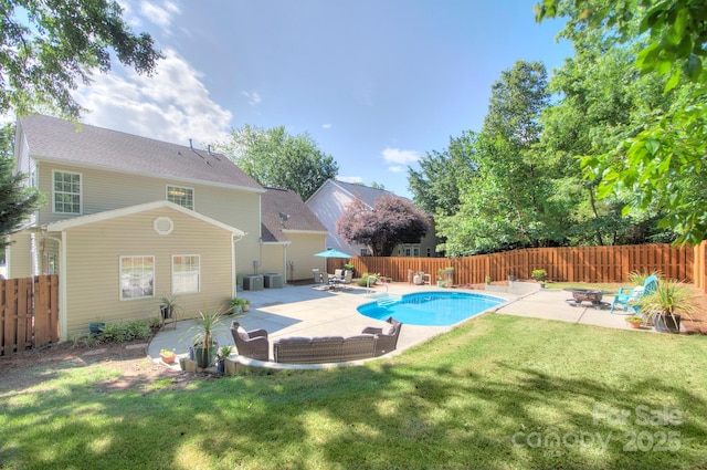 view of swimming pool featuring a patio area and central air condition unit