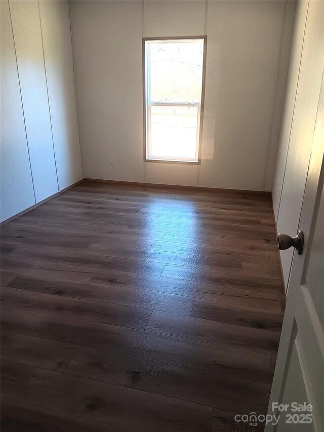 104 Advent Dr, Grover, NC 28073 - unfurnished room with dark wood-style floors and baseboards