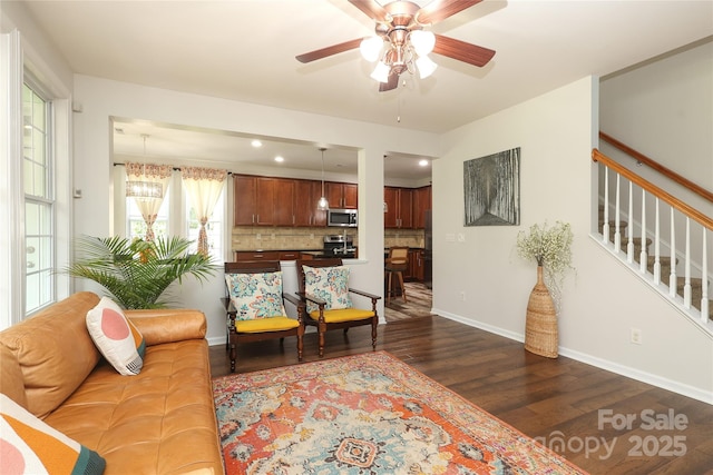 10217 Falling Leaf Dr, Concord, NC 28027 - living room with dark wood finished floors, a ceiling fan, baseboards, stairway, and recessed lighting