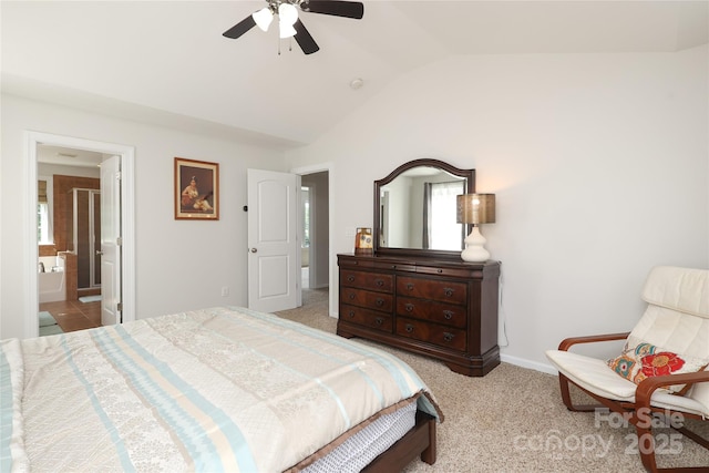 10217 Falling Leaf Dr, Concord, NC 28027 - bedroom with vaulted ceiling, a ceiling fan, baseboards, ensuite bath, and carpet