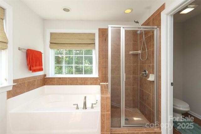 10217 Falling Leaf Dr, Concord, NC 28027 - bathroom featuring a bath, toilet, a stall shower, and recessed lighting