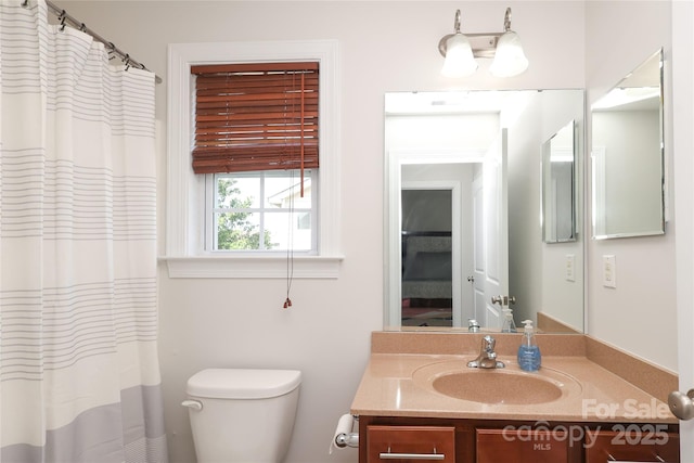 10217 Falling Leaf Dr, Concord, NC 28027 - bathroom featuring vanity, toilet, and a shower with shower curtain