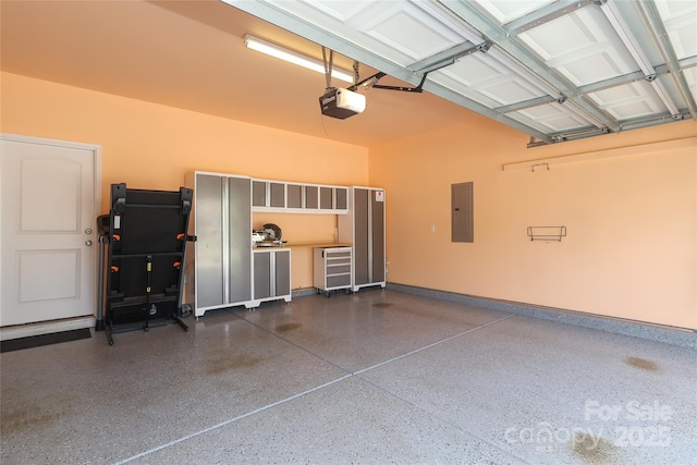 10217 Falling Leaf Dr, Concord, NC 28027 - garage with electric panel, a garage door opener, and baseboards