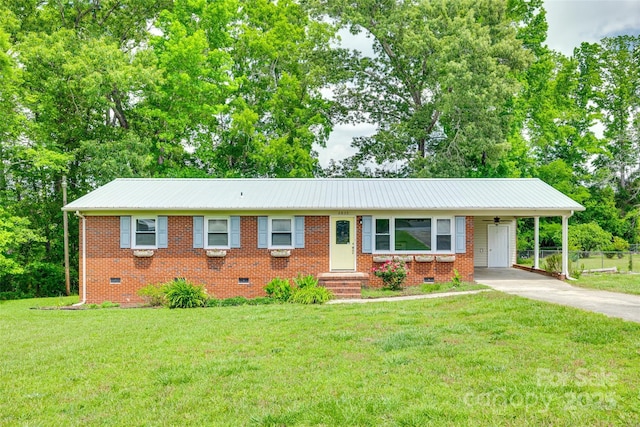 ranch-style house featuring crawl space, driveway, a carport, and metal roof