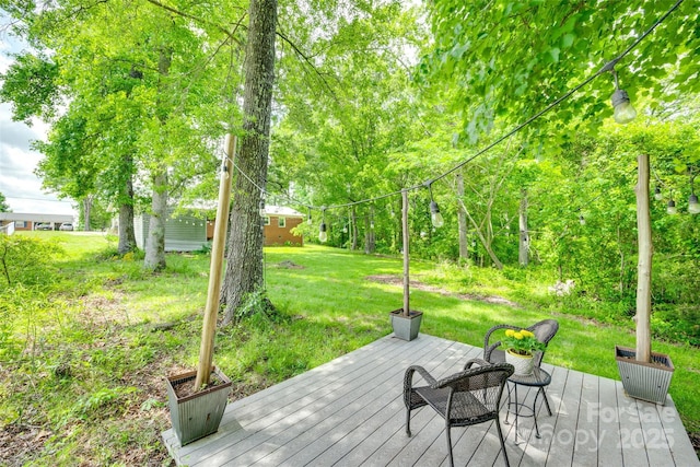 wooden deck with a yard