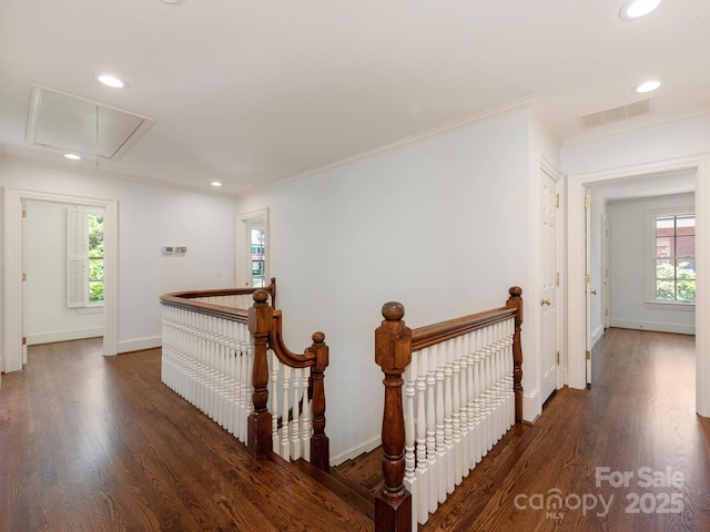hallway featuring attic access, an upstairs landing, healthy amount of natural light, ornamental molding, and recessed lighting