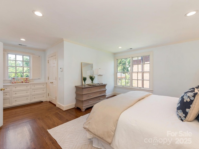 bedroom with crown molding, dark wood-type flooring, recessed lighting, and baseboards