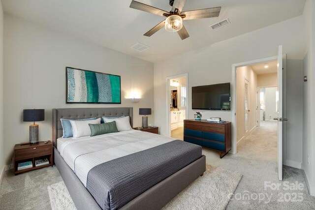 bedroom with light colored carpet, a ceiling fan, and baseboards