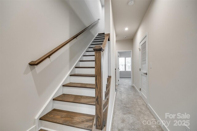stairway with baseboards, carpet flooring, and recessed lighting