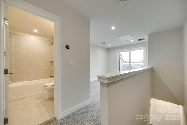 hall featuring baseboards, recessed lighting, an upstairs landing, and carpet
