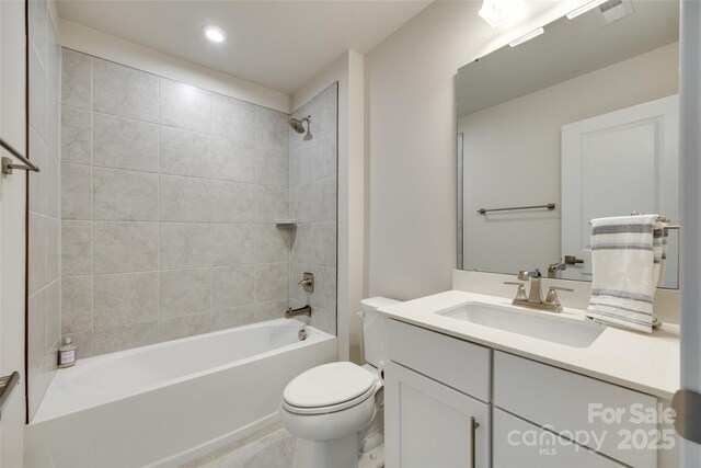 bathroom featuring toilet, vanity, shower / bathtub combination, recessed lighting, and tile patterned floors