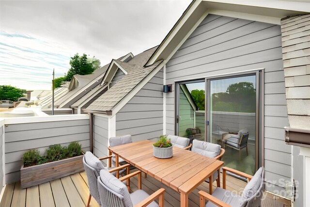 deck with outdoor dining area