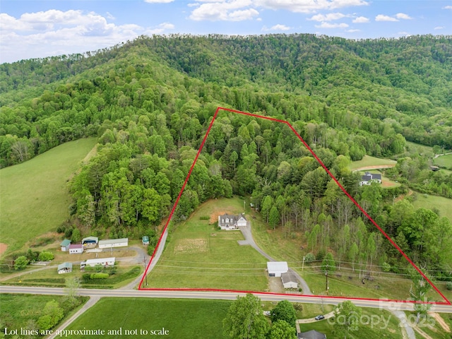 drone / aerial view with a view of trees