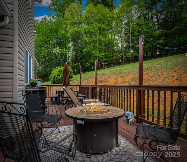 deck featuring a fire pit
