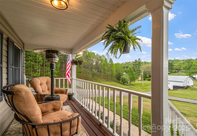 wooden deck with a yard