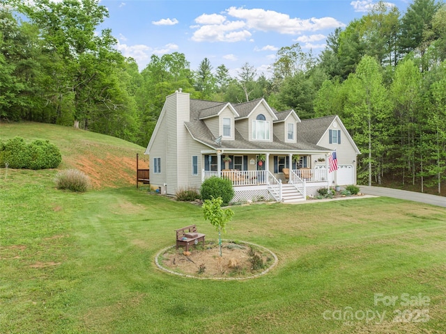 new england style home featuring covered porch, concrete driveway, a front lawn, and a chimney