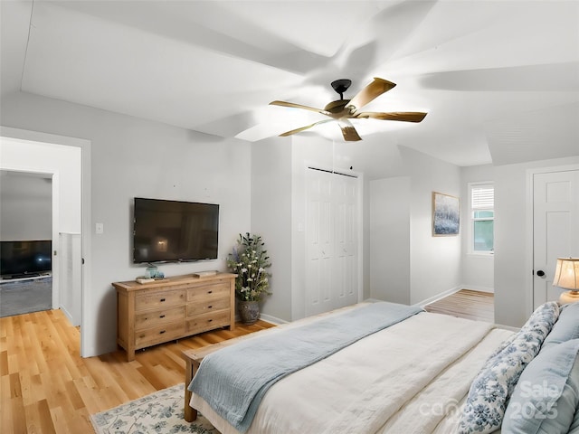 2581 Double Island Rd, Green Mountain, NC 28740 - bedroom featuring baseboards, a closet, a ceiling fan, and light wood-style floors