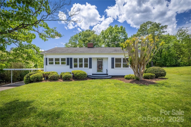 417 Mountain View Ave SE, Valdese, NC 28690 - ranch-style house featuring a chimney, a front yard, and a carport