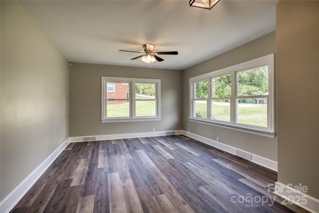 417 Mountain View Ave SE, Valdese, NC 28690 - spare room with dark wood finished floors, a ceiling fan, and baseboards