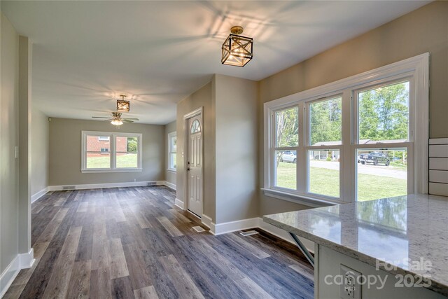 417 Mountain View Ave SE, Valdese, NC 28690 - unfurnished dining area with baseboards, dark wood finished floors, and ceiling fan