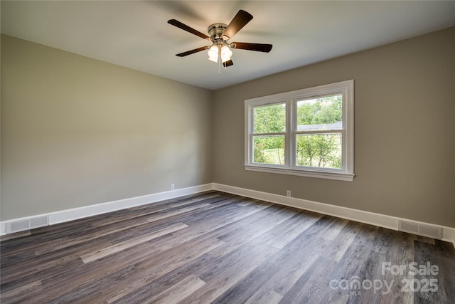 417 Mountain View Ave SE, Valdese, NC 28690 - spare room featuring baseboards, dark wood-style flooring, and ceiling fan