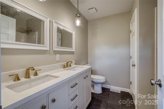 417 Mountain View Ave SE, Valdese, NC 28690 - full bathroom with toilet, baseboards, double vanity, and a shower