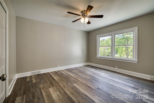 417 Mountain View Ave SE, Valdese, NC 28690 - spare room with dark wood-style floors, ceiling fan, and baseboards