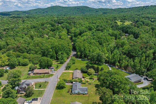417 Mountain View Ave SE, Valdese, NC 28690 - aerial view of property's location with a forest and a mountain backdrop