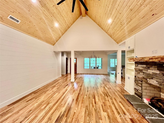 unfurnished living room featuring light wood finished floors, ceiling fan, wooden ceiling, high vaulted ceiling, and baseboards