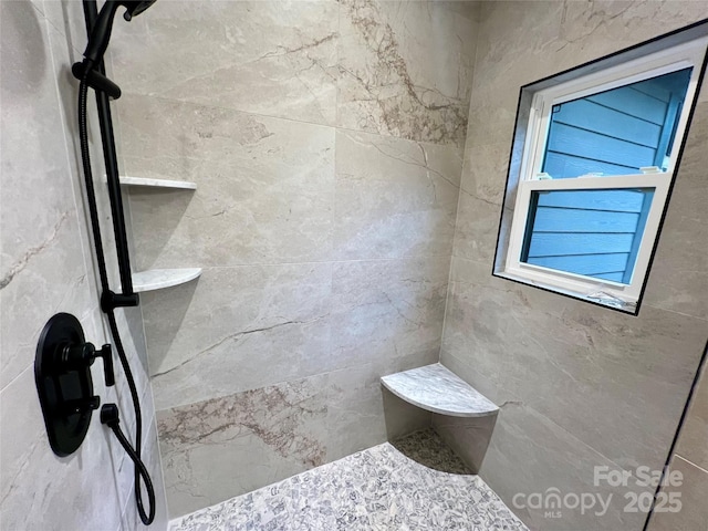 bathroom featuring tiled shower