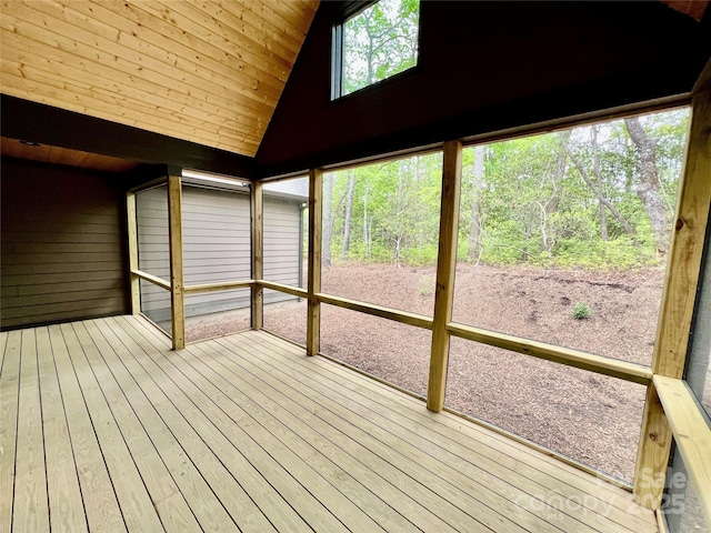 unfurnished sunroom with lofted ceiling