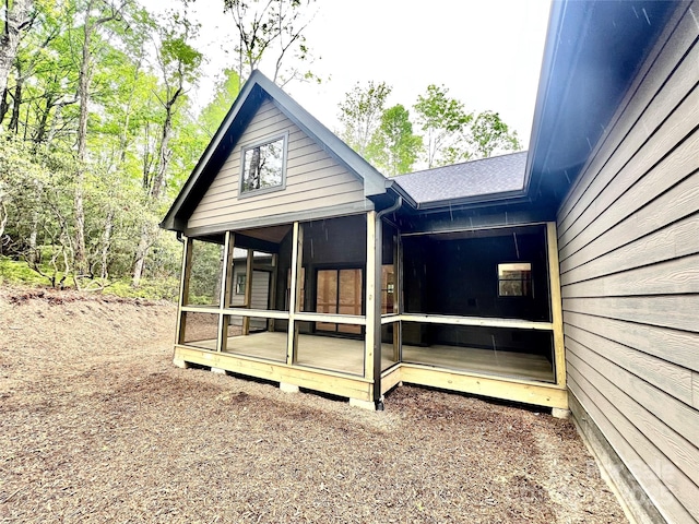 back of house with a sunroom