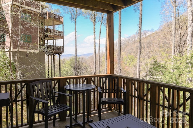 81 Creekside Way Unit F/101, Burnsville, NC 28714 - wooden terrace with a wooded view