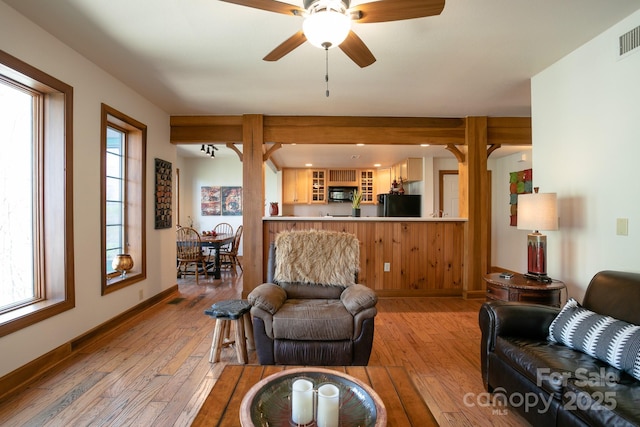 81 Creekside Way Unit F/101, Burnsville, NC 28714 - living area featuring light wood-type flooring, a ceiling fan, and baseboards