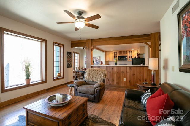 81 Creekside Way Unit F/101, Burnsville, NC 28714 - living room with light wood-style flooring, ceiling fan, and baseboards